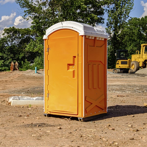 what is the cost difference between standard and deluxe portable toilet rentals in Red Jacket